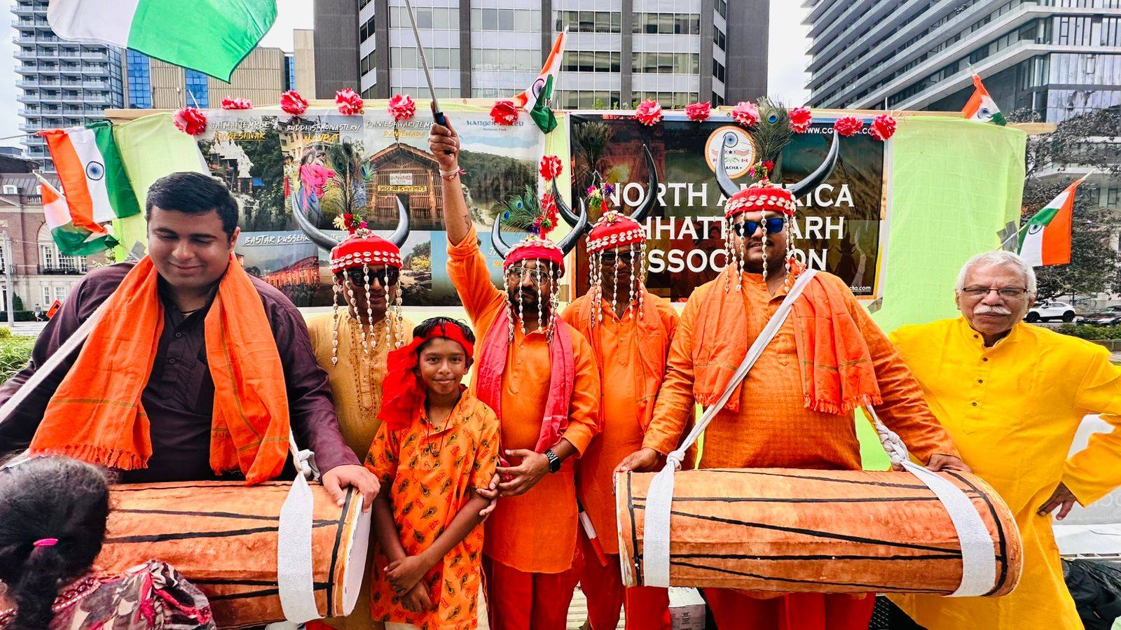 Chhattisgarhi drummers with traditional horned headgear at a North America parade